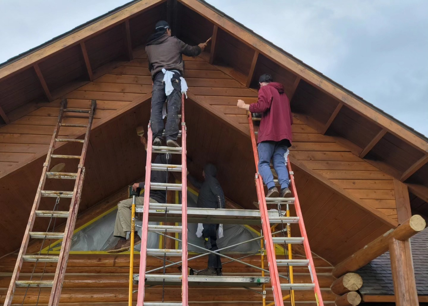Custom Chinking Crew on Ladders